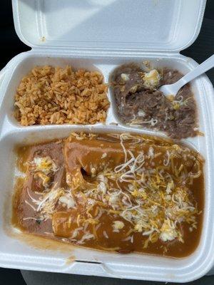 Two enchiladas with rice and beans.