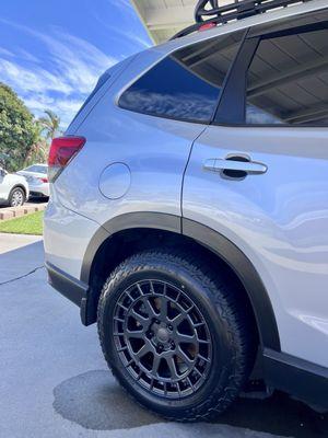 225/60R17 Falken Wildpeaks with 17" Black Rhino boxer wheels on stock suspension