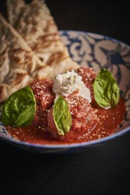 The 3-Ball: Our slow braised meatballs in house marinara, topped with whipped ricotta, EVOO, chili flakes & sal de mar with forno bread.