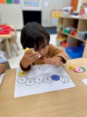 Number matching in the 2's classroom for number recognition!