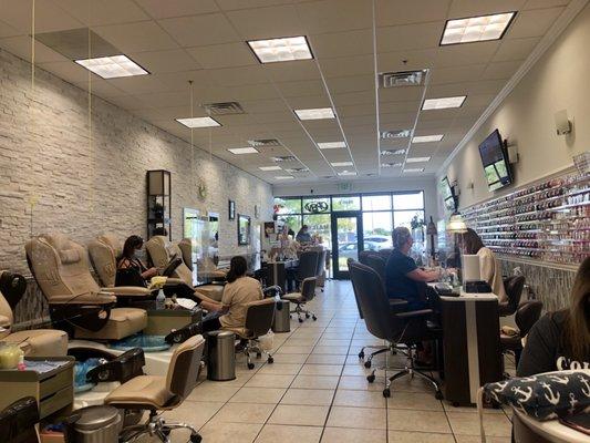 View from back of salon towards the front. Pedicures on left, manicures on right. Wax room is private.