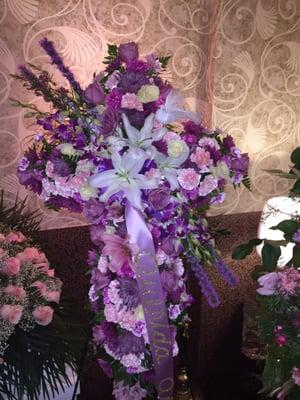 Floral cross - extra details like ribbon, doves, white lilies, veronicas, orchids and roses.