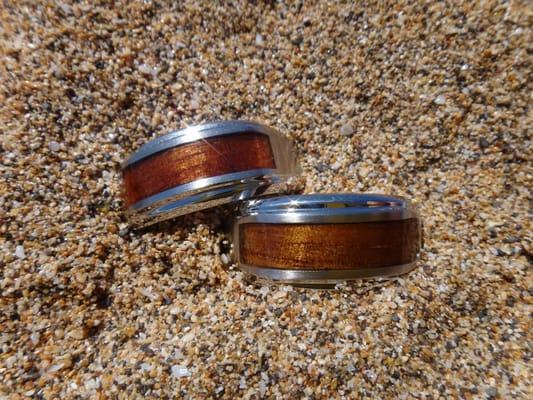 Stainless steel rings with Koa wood insets.