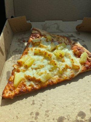 Slice of pizza with onion and pineapple. Soooooo good!  Crispy yet soft crust.