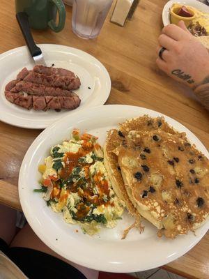 Blueberry banana pancakes, egg white veggie scramble, and apple chicken sausage.