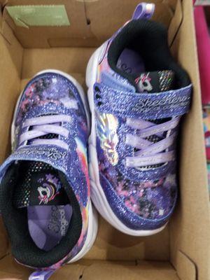 Little ladies, unicorns and sparkles. Nice kid shoe selection.