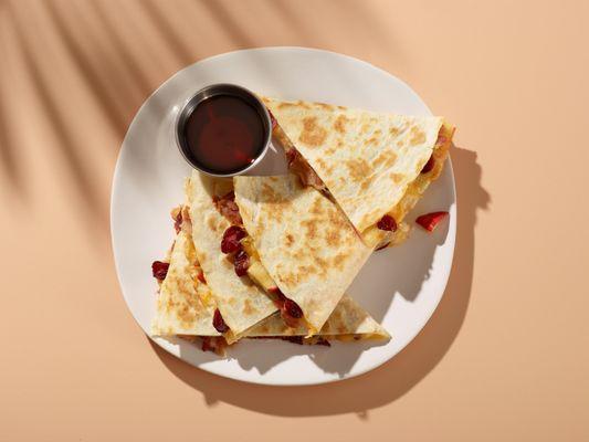 A shocking combo of cranberries, apples, bacon and cheese all in a quesadilla.