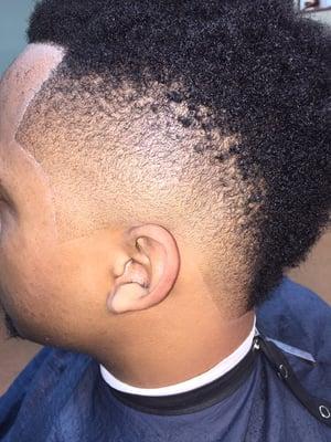 Crispy and clean Mohawk with razor sharp lining.