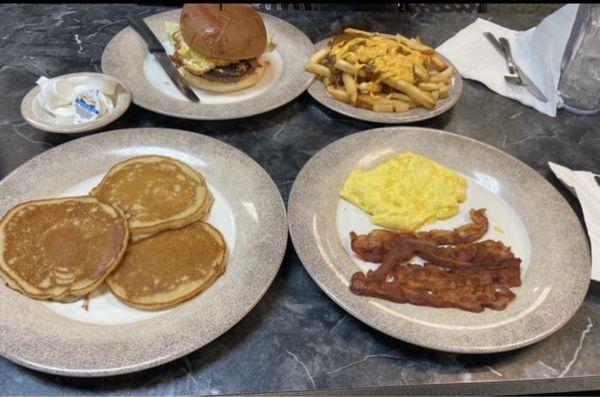 Buttermilk Pancakes, Bacon, and Eggs  Cheeseburger and Chili Cheese Fries