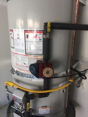 Bradford White water heater with hot water recirculation pump including isolation valves.