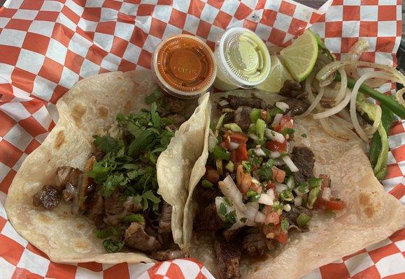 One bistek taco on flour and one asada taco on flour