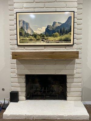 50" Frame Tv and wooden mantle.