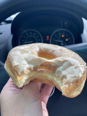 Raised Maple Donut with a happy bite