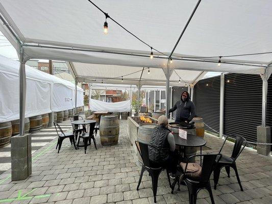 Outdoor covered seating with fire  table