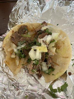 Bitten carnitas taco