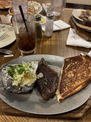 Steak and baked Potato delicious.