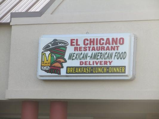 Sign on the overhang at the mini mall where the restaurant is