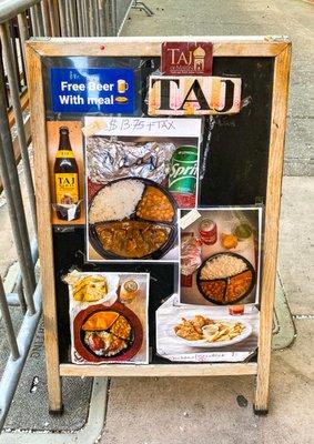 Sandwich board with offerings - and free beer with meal!