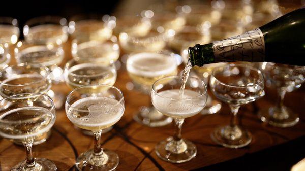 Complimentary champagne pour for wedding's head table