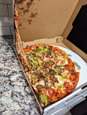 16-inch Classic. $25.99 + $2.00 for extra mushrooms, pre tax, delivery fee, and tip. Pizza shifted during delivery, but still tasted great.