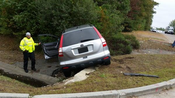 Car over curb.