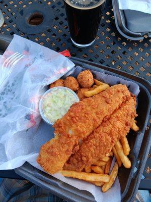 Fish and chips..with hush puppies even.... fries Cole slaw and fries..... whaaaat?