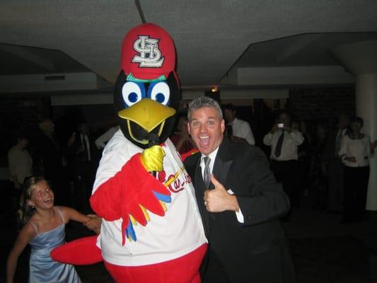 Fredbird holding my microphone at a wedding.