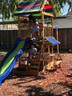 Developing gross motor skills as our student climbs up the ladder.