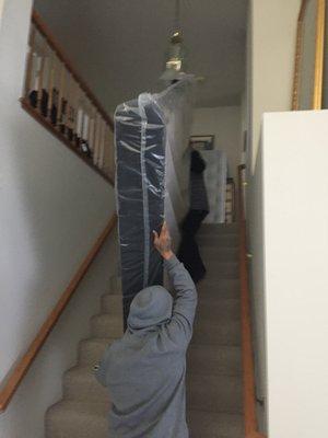 Julio and Alejandro bringing in the new mattress