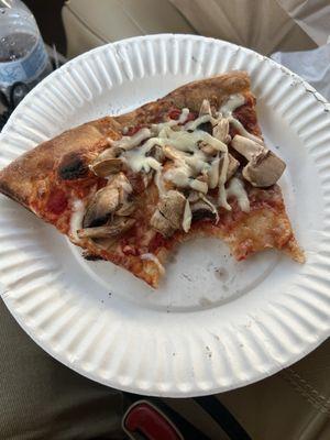 Supposedly, fresh mushroom pizza slice