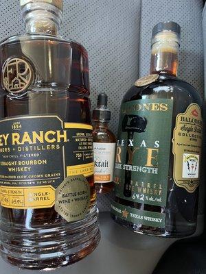 Today's haul,  Frey Ranch Single Barrel and Balcones Texas Rye Single Barrel, and some orange bitters.