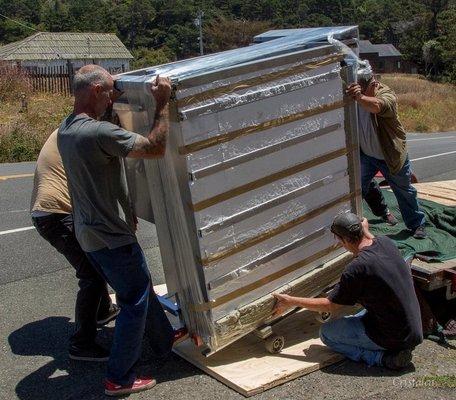 Delivering a 3,000 lb oven to Two Fish Bakery. Oven needed to be disassembled and reassembled to fit through the door.