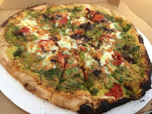 Cilantro pesto, oven dried tomato, chili sauce pizza.