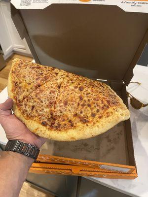 The cheese pizza I just got is hard as a rock.