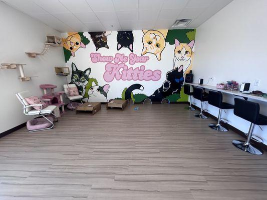 The cute cat cafe room w cats and mural