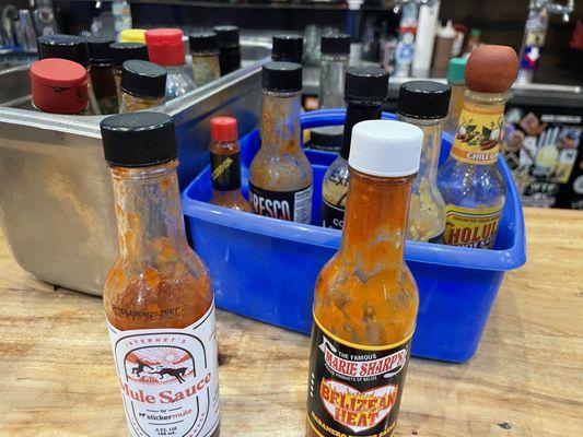 Local's sauces behind the bar.