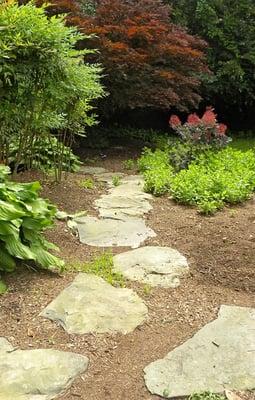 Nestled in a relaxing and peaceful setting, follow the fieldstone path amidst fresh herbs and native plants.