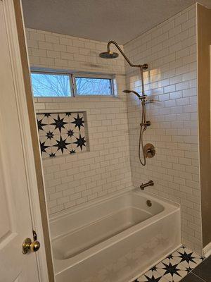 We replaced the old tub with a new American Standard Alcove tub and added a PULSE ShowerSpas, Inc.  Kauai shower system in Brushed Gold. Exi