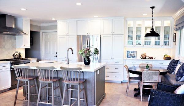 This bright family kitchen features stainless steel appliances and an oversized island.