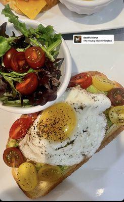 Artisanal toast, mashed avocado, sunny-side up egg, hot honey & side salad