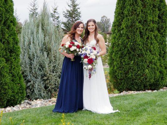 Wedding bouquets design with red, white and blue flowers and greenery.