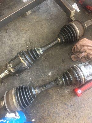 Two worn out front axles and broken CV Joint boots