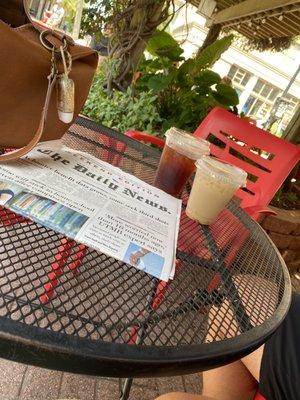 Shaded patio seating, iced chai tea latte and the daily news