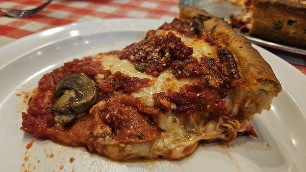 The Medium Deep Dish with pepperoni, mushrooms, and extra onions was great! Lots of cheese!