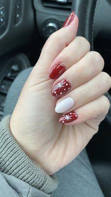 Almond shaped dip nails with accent nail and designs