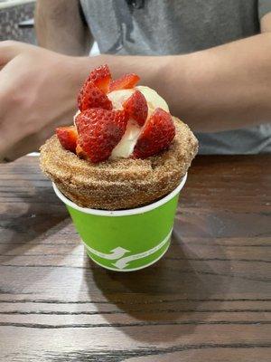 churro cup with vanilla ice cream and strawberries