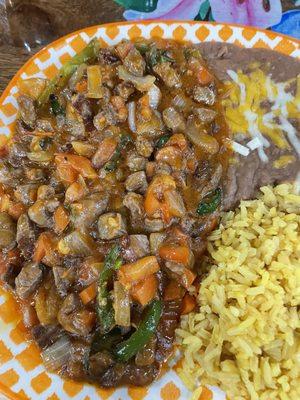 Guiso Norteno! Real chunky steak meat.With the best favor ever.A huge plate.With chunks of veggies .the beans and rice were wonderful