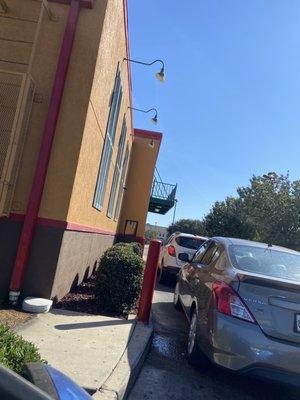 Drive thru they won't let Pull up to the window until they wave u up. What's the reason for that ?