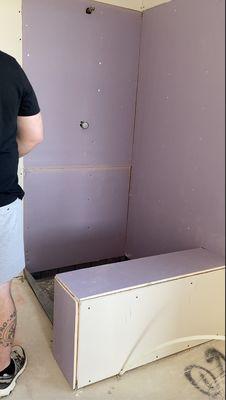 purple dry wall in the shower during the build process. Wish I had known more about constructing, but I do now.