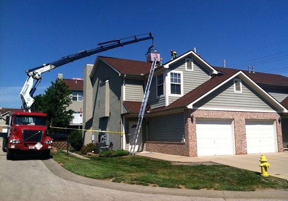 In most cases we are able to load materials directly onto your roof.  This prevents unnecessary damage heavy materials can cause your lawn